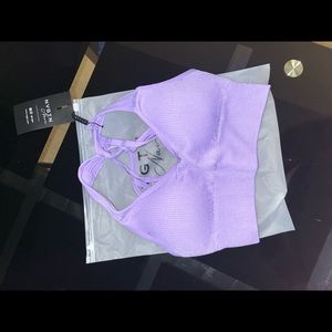 XS purple NVGTN sports bra.